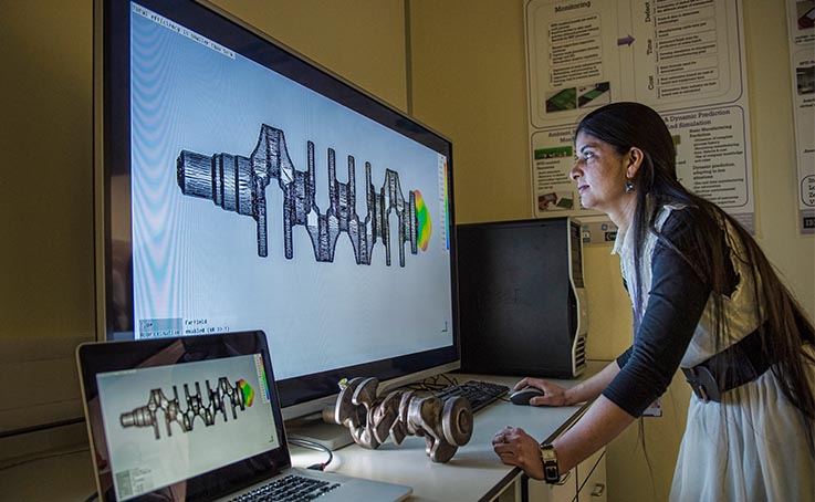 resaercher inspecting CAD model of crankshaft on computer screen